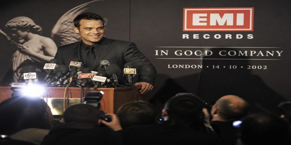 Historical re-creation of the 2002 EMI press conference announcing the historic 80 million pound recording contract with Robbie Williams.